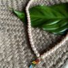 Pearl Neckpiece With A Happy Pendant